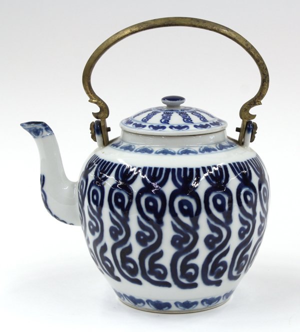 Chinese Thai Porcelain Teapot, Rama V Monogram: Chinese underglaze blue porcelain teapot meant for the Thai market, late 19th century, the globular body decorated with columns of King Rama V monograms, while bands of bats encircle the base of the m