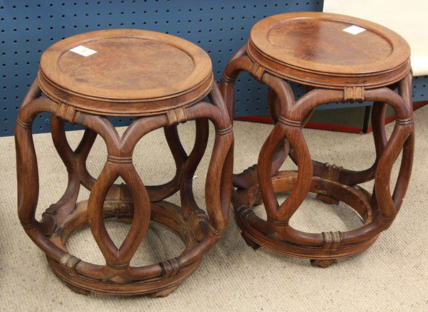 Two Chinese Wooden Barrel Form Stools: (Lot of 2) Chinese barrel-form wood stools, each with a circular burlwood panel top set within a bead edge frame, the openwork sides of bounded faux-bamboo construction and joined to a circular base r