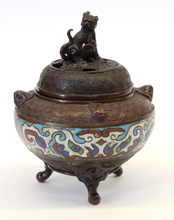 Asian Champleve Small Censer: Asian small champleve covered censer, the compressed body cast with tortoise shell pattern to the shoulders heightened with zoomorphic handles, above white champleve taotie masks, raised on three zoom