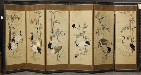 Asian Embroidered Screen, Cranes and Bamboo: Asian large six panel embroidered screen, depicting a flock of cranes amid a bamboo grove, executed in satin stitches and couched with wrapped threads (losses and stains), overall: 71''h x 145''w