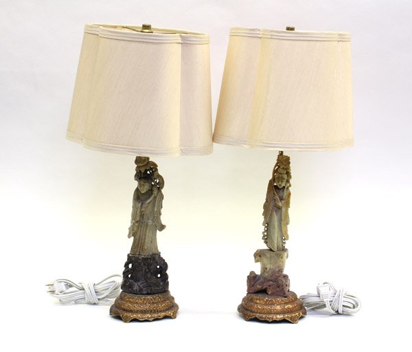 Chinese Soapstones Figures/Lamps: (Lot of 2) Chinese soapstone carvings, currently mounted onto lamps, each depicting a celestial beauties clutching a large lotus sprig standing on a plinth (one repaired), 10''h