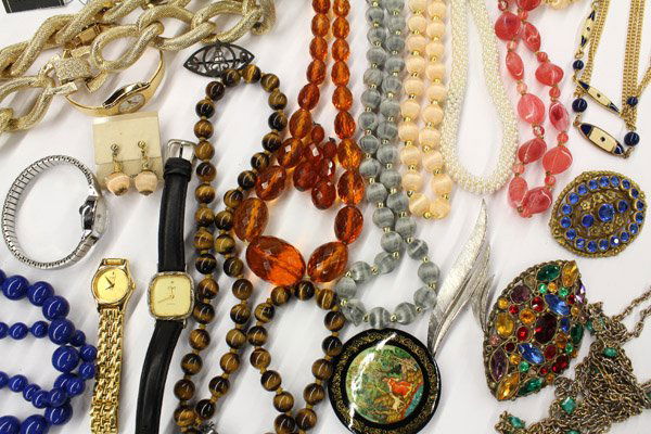 Collection of miscellaneous fashion jewelry items: Collection of miscellaneous fashion jewelry items, mostly; necklaces: one gold toned, textured link, stamped Coro, tiger eye, beaded; bracelets: full bangle, side hinged, wooden (one broken); brooches