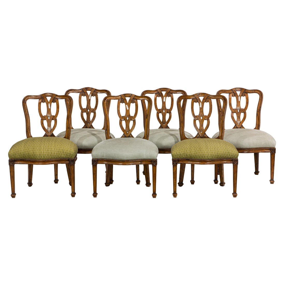 A suite of six Continental dining chairs, each with a pierced back with scroll work reserves, (1 of 3)