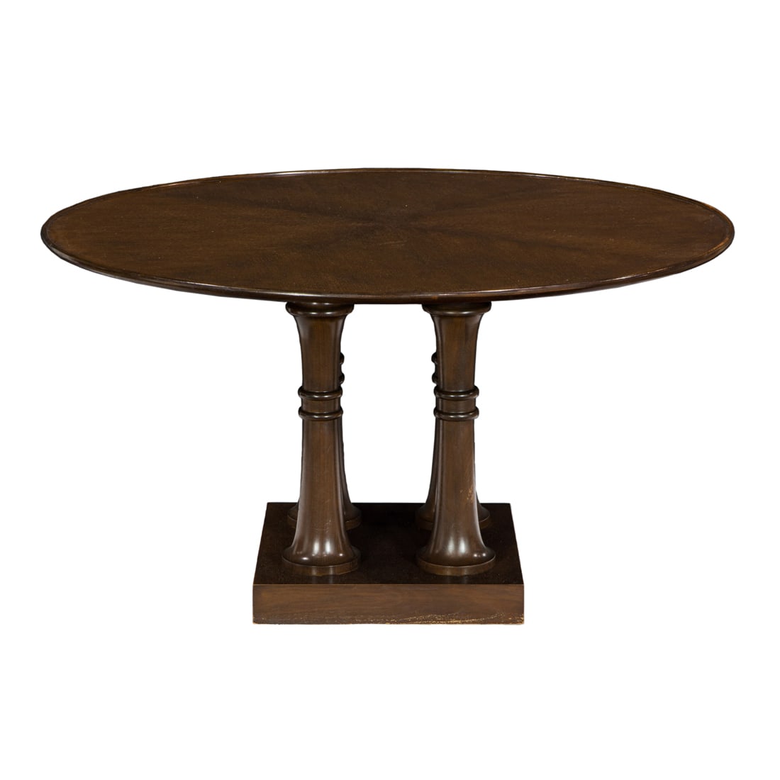 A Michael Berman Ltd walnut Palma dining table: A Michael Berman Ltd walnut Palma dining table, the round top raised on four-column base, factory tag to underside, 30"h x 54"dia