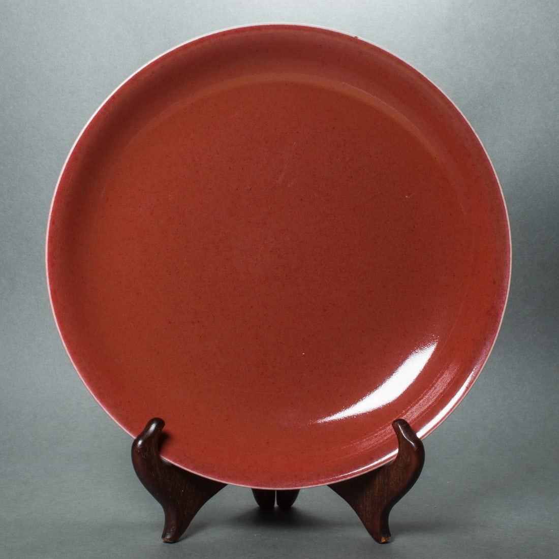 Chinese ox-blood glazed saucer dish: Chinese ox-blood glazed saucer dish, Daoguang mark, 8.25" wide.