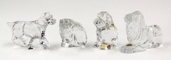 Crystal animal figural group: (lot of 3) Crystal animal figural group consisting of an Orrefors puppy 4.5''h, a Baccarat working dog 4.5''h x 8''l, Waterford cat 3.5''h, and a Waterford lion 4.5''h x 6.5''l