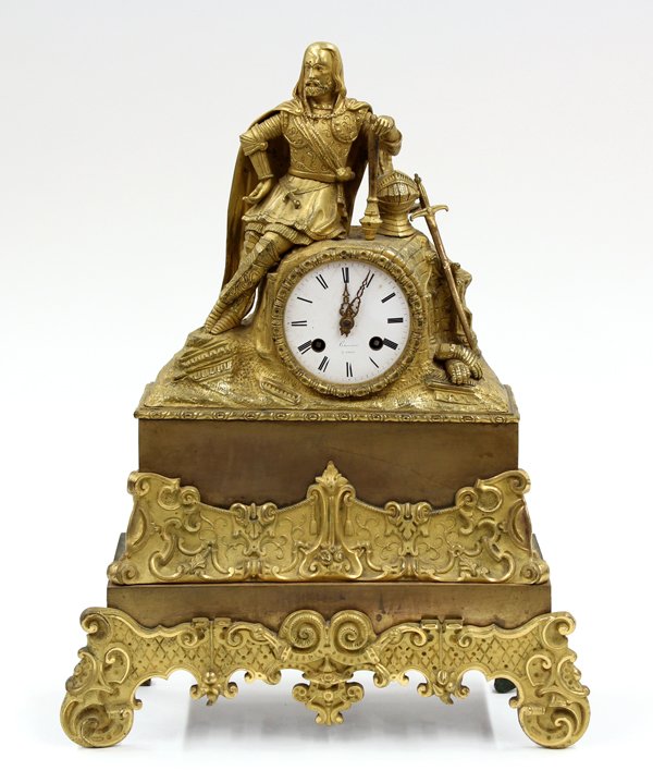 French gilt bronze mantle clock: French gilt bronze and patinated metal mantle clock circa 1890 marked ''Chauveau a Paris'', the ormolu decorated case having a figural mount depicting a cavalier, accented with regal attire and surmou