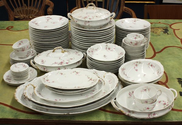 Limoges table service: (lot of 101) Theodore Haviland Limoges table service, each having a floral accented border on a white ground, consisting of (15) dinners 10''w, (17) luncheons, (16) salads, (9) soups, (17) berry bowls