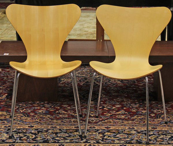 Jacobsen series 7 chairs: (lot of 2) Arne Jacobsen for Fritz Hansen ''Series 7'' side chairs, having a shaped beechwood continuous back and seat, and rising on tubular legs, each retains Fritz Hansen label with date on undersi