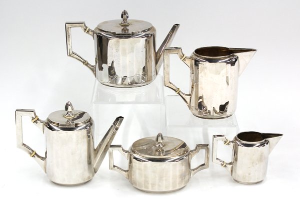 Austrian silver beverage service: Austrian Art Deco five piece beverage service, by Hermann Sudfeld, Vienna, 1883-1909, of ribbed cylindrical form, comprising coffee pot, teapot, covered sugar, creamer, and pitcher, 59.14 troy oz.