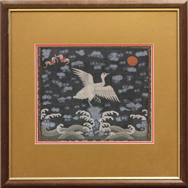 Chinese Kesi Rank Badge: Framed Chinese kesi woven Mandarin square, Qing dynasty, featuring a white bird perched on a rock above crashing waves and amid stylized clouds brightened by a red sun and a pair of bats, sight: 8.8''