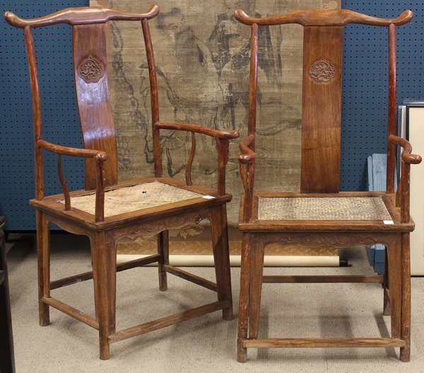 Two Chinese Yoke Back Arm Chairs: Pair Chinese yoke back arm chairs (guan mao yi), with a shaped top rail fitted to an ''S'' contoured narrow back splat carved with a meandering dragon within a lobed reserve, along with shaped arms co
