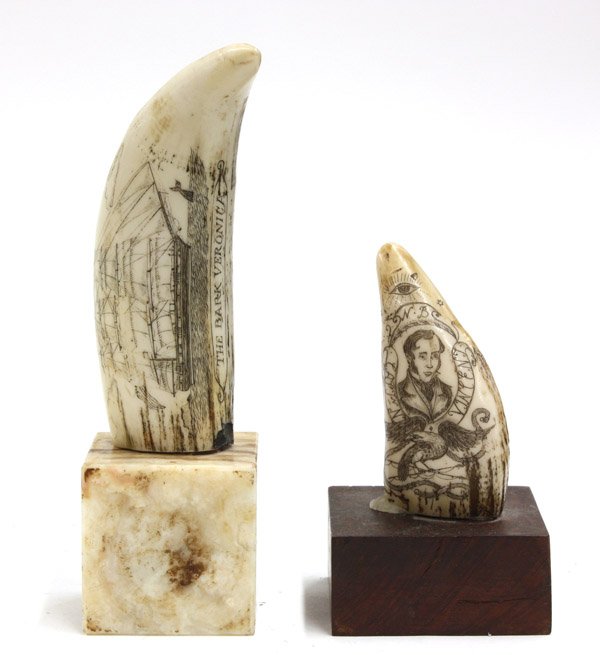 Scrimshaw decorated teeth: Two scrimshaw decorated whale's teeth mounted to marble and wood plinths, including one featuring a portrait of Napoleon Bonaparte, tallest: 8''