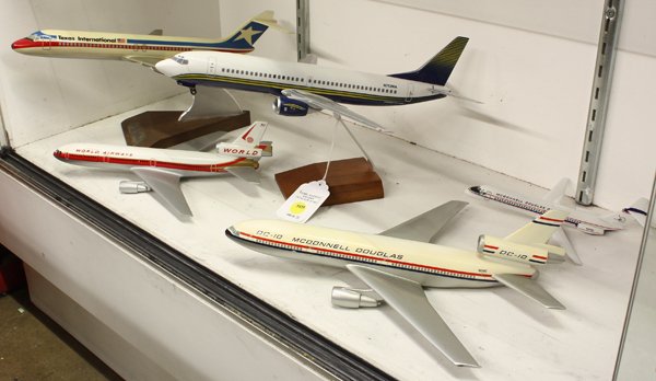 Vintage Model Airplanes: (lot of 5) Group of vintage airplane models including, Texas International, World Airways, McDonnell Douglas DC-9, McDonnell Douglas, DC-10 together with a model number N752MA, longest: 14''