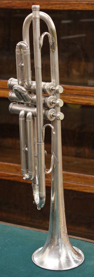 Trumpet: Pan American silver plated trumpet and case, 20.25''l, (no mouth piece) Provenance: Unaccessioned by the Honolulu Museum of Art