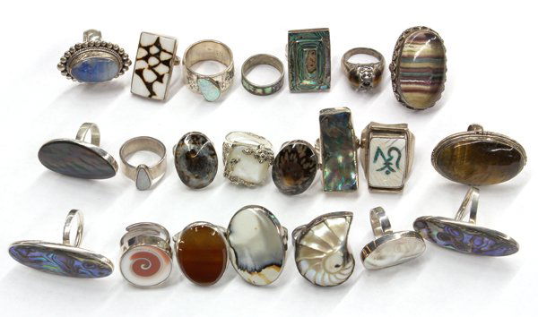 Lot of (22) white metal and various gemstone ring: Lot of (22) various colored gemstone rings; (5) of the rings are not stamped and (17) mountings stamped ''925'' for sterling silver, set with agate, fluorite, mother-of-pearl, abalone, tigers' eye, sy