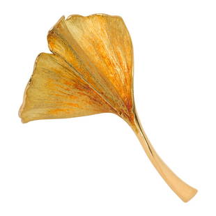 An 18k gold brooch, John Iversen: An 18k gold brooch, John Iversendesigned as a ginkgo leaf; signed Iversen 18kt; 8.85 dwt; length: 2 1/8 in