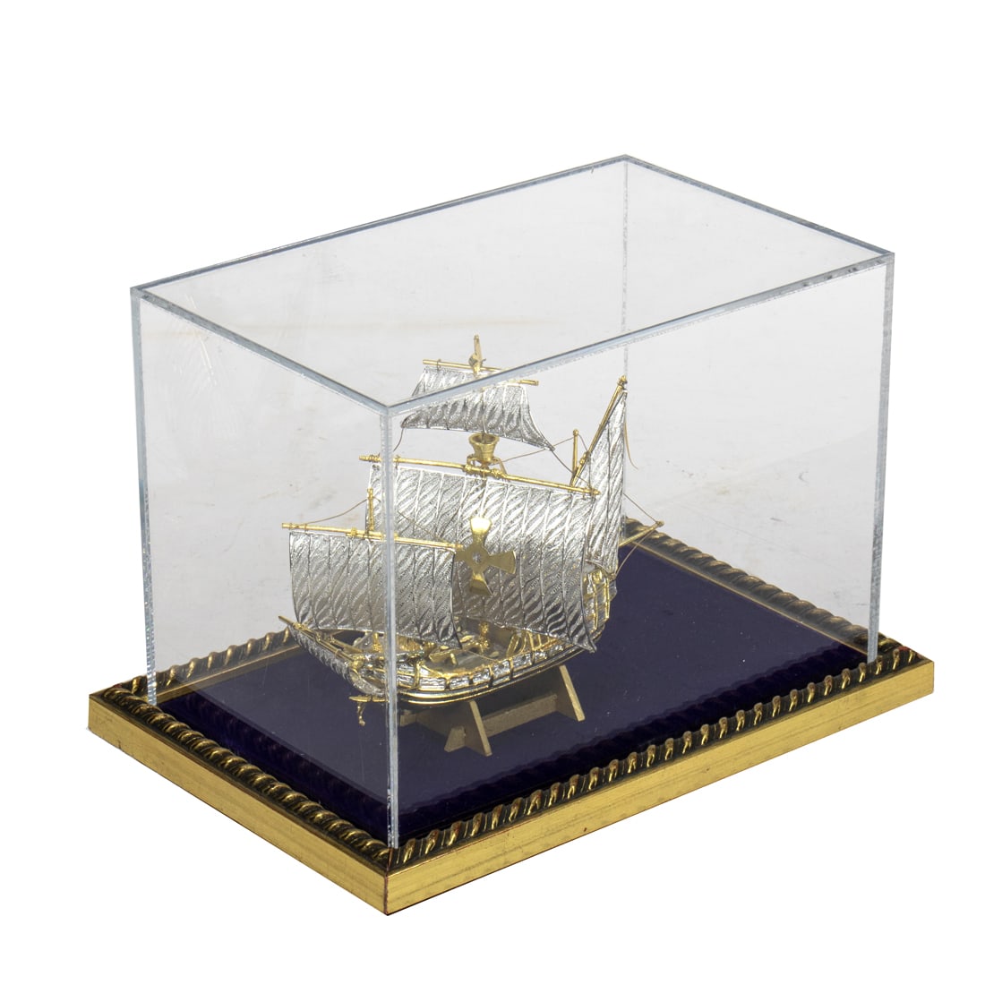 A miniature silvered metal model of Santa Maria with silver filigree sails, US Historical Society: A miniature silvered metal model of Santa Maria with silver filigree sails, US Historical Society 040/500 edition, mounted in a lucite box, overall 6.5" x 9.25" x 6.25"