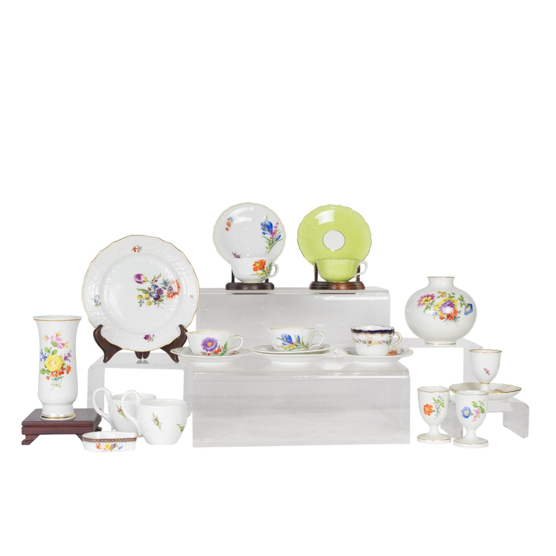 A group of Meissen floral decorated porcealin: A group of Meissen floral decorated porcealin, 20th century, each with underglaze blue crossed swords, comprising (2) vases, greatest 5.75"h; (3) egg cups; (1) ozier modled; plate, 7"dia; (2) swan han