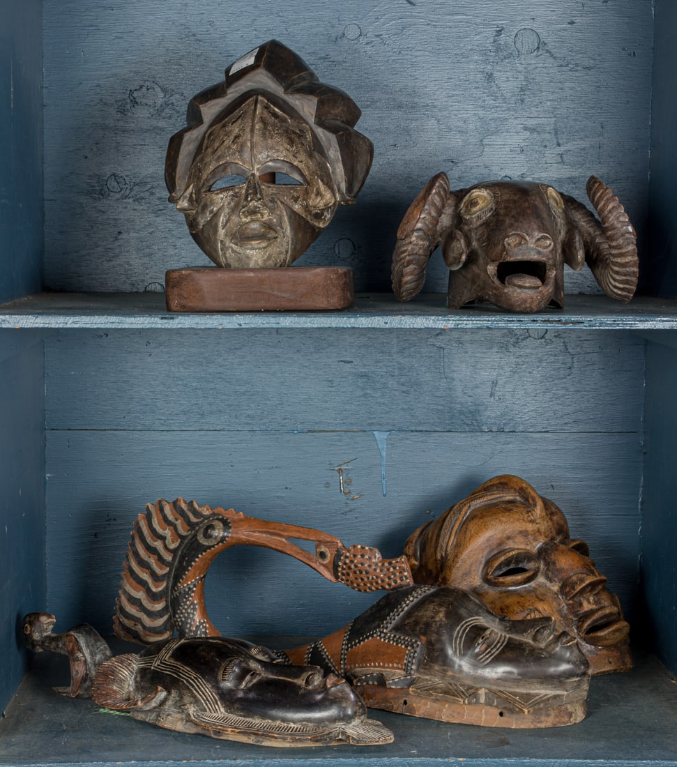 A group of five tribal carved wood masks (1 of 1)
