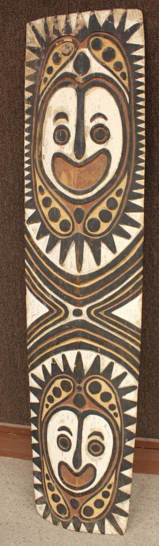 Polychrome Shield, Huon Gulf, New Guinea: Huon Gulf, New Guinea, polychrome shield having two faces in vivid pigments, slight signs of possible use, 70''h x 16''w. Provenance: The Hemphill Collection of San Francisco