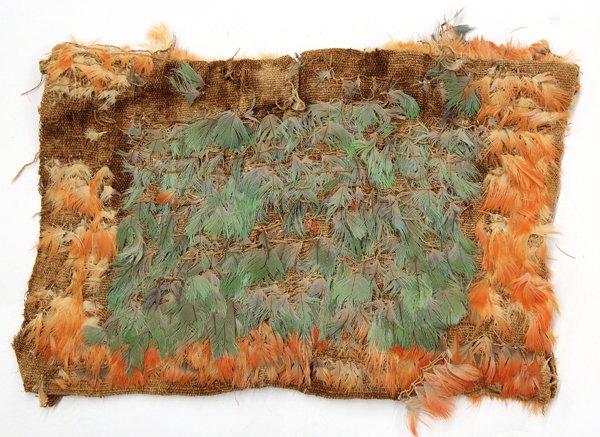 Pre-Columbian Baby's Vest: Pre-Columbian baby's vest of multihued bird feathers, long buried in a dry Peruvian Pre-Columbian tomb and made to accompany the deceased in the Afterlife, probably Nazca, southern Peru, circa AD 200-