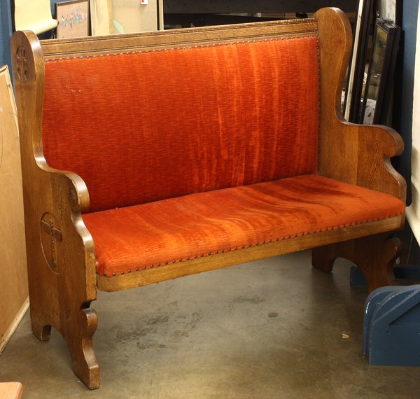 Arts and Crafts carved settle: Arts & Crafts oak carved settle, executed for a Seattle maritime chapel, the relief carved sides depicting a stylized winged totem which reads Boeing, having an upholstered seat and back and rising on