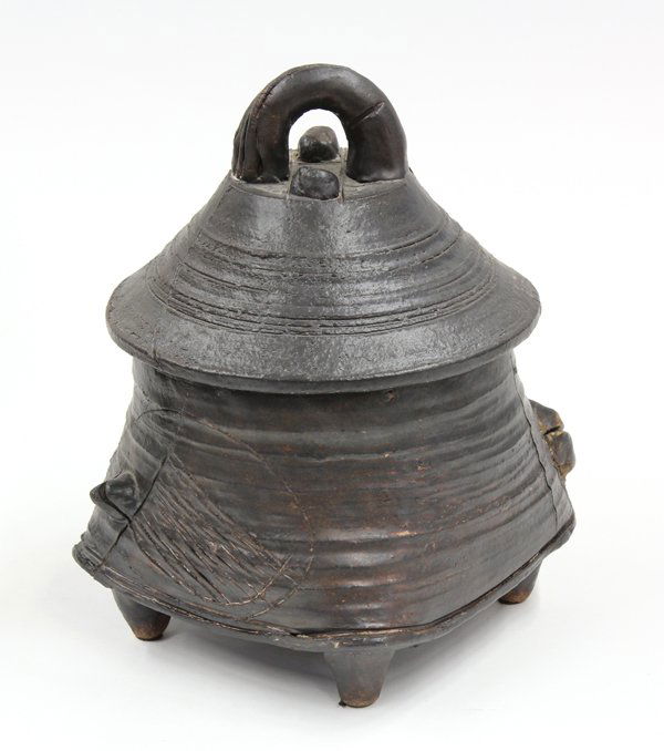 Ted Randall earthenware vessel: Ted Randall earthenware covered vessel, the conical top with incised decoration above the footed base with raised accents, signed T Randall on underside, 12''h x 8''w