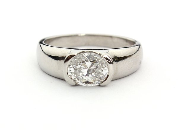 Platinum solitaire diamond ring: Solitaire diamond ring; mounted in platinum, set with (1) oval brilliant cut diamond weighing 1.18 cts., H color, I-1 clarity. Total ring weight 9.99 grams. Ring size 6.75.