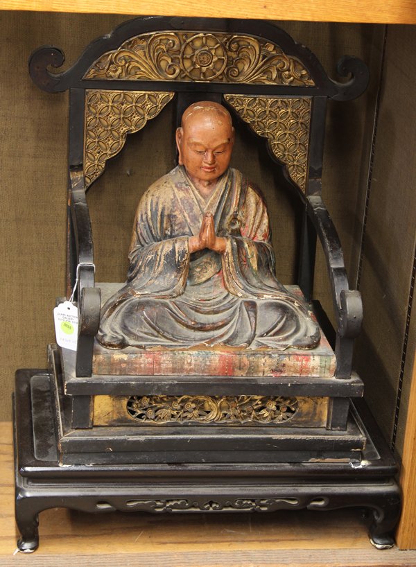 Japanese Lacquered Wooden Monk, Meiji: Japanese polychrome decorated wooden figure of Neichiren, Meiji period, the Buddhist monk in a blue robe and with hands clasped to the front, seated on a separate throne carved with a gilt chakra flan
