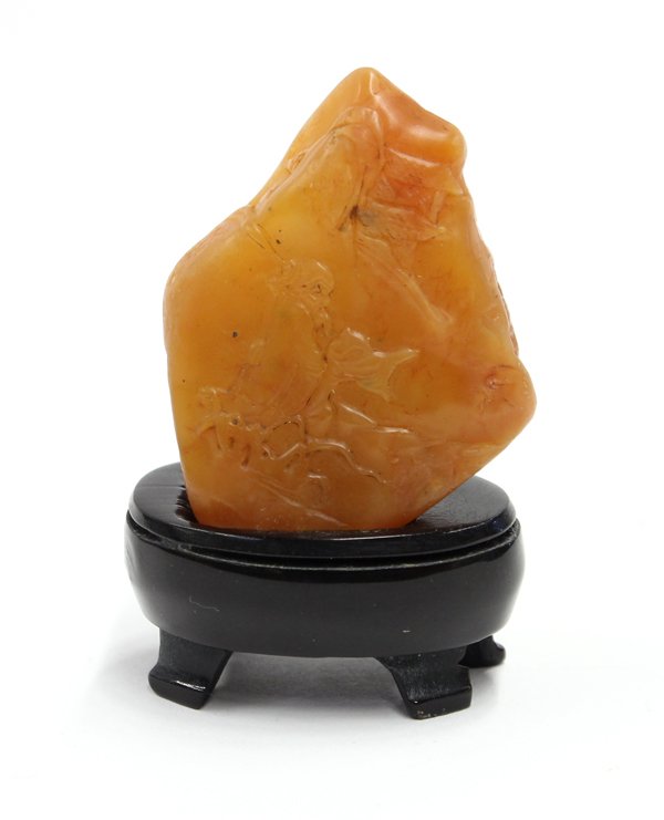 Chinese Soapstone Seals: (lot of 2) Chinese soapstone seals, the first a small pebble carved with a scholar, reversed with boats docked under a bridge; the second, a tall rectangular plinth with a rounded top, the sides featu