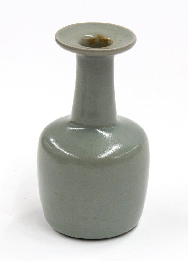 Chinese Celadon Glaze Vase: Chinese celadon glazed bottle vase, with a wide everted rim above a long cylindrical neck along with an angular shoulder and wide cylindrical body, 5''h