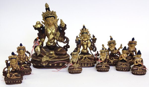 Nepalese Tara and Buddha Figures: (lot of 10) Group of Nepalese copper alloy figures of Tara and Buddha, 20th century, consisting of eight seated Taras and two seated Buddhas, each with attributes and some gilding, 8.5''h; Provenance: