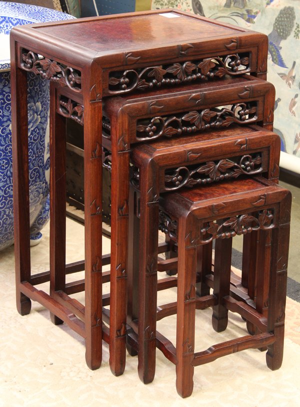 Chinese Wooden Nesting Tables: Set of four Chinese nesting tables, each inset with a burlwood top within a faux-bamboo edge and supports, the apron reticulated with fruiting branches, 28.125''h