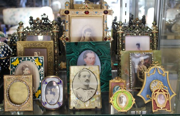 Picture frames: (lot of 14) Group of associated picture frames of various compositions including onyx-marble, enameled alpaca silver, faux malachite, patinated and polychromed metal encrusted with rhinestones, talles