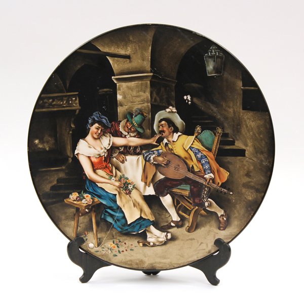 Mettlach scenic charger: Villeroy Boch Mettlach ironstone scenic charger circa 1890, the polychrome decorated plate depicting a Bavarian festive scene of merriment, verso having a green underglaze mark, 17''w