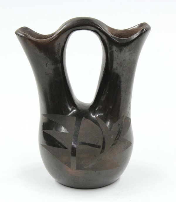San Ildefonso blackware wedding vase: San Ildefonso blackware wedding vase, the shaped body centerred with a stylized leaf medallion, 7''h