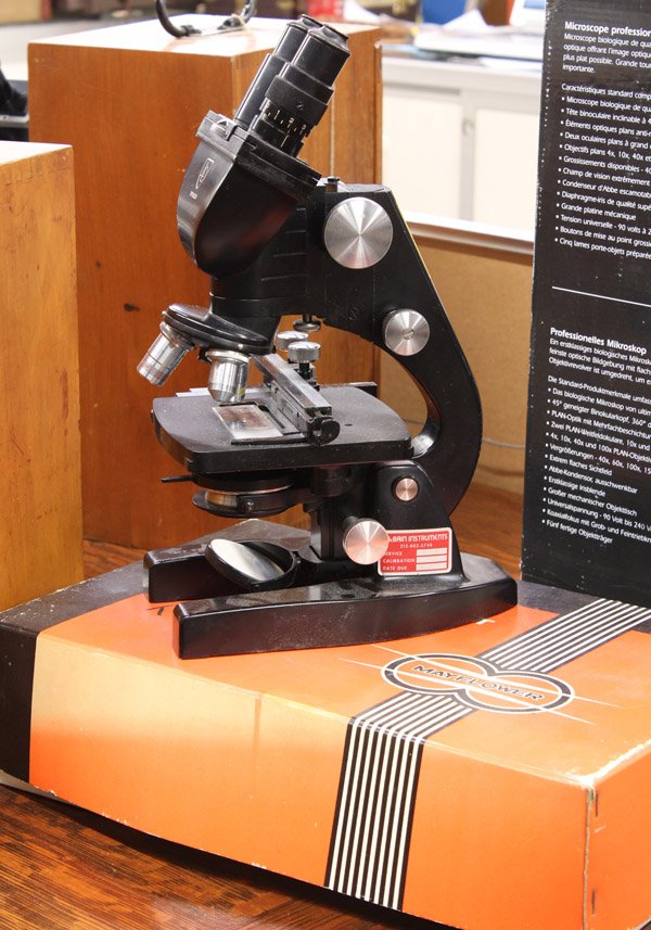 Microscope group: (lot of 2) A.O Spencer laboratory microscope, together with a boxed Mayflower microscope kit