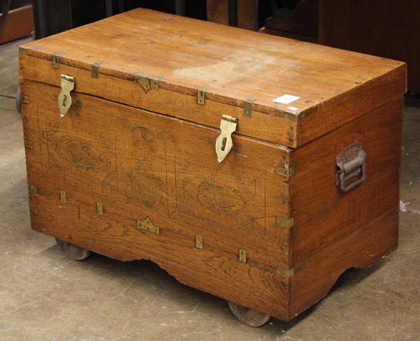 Anglo Indian hardwood storage chest: Brass banded Anglo Indian hardwood storage chest circa 1920, on wheels with carved and mirrored interior, 18''h x 27''w x 15''d Provenance: The Hemphill Collection of San Francisco
