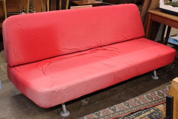 James Irvine sofa/ Cappellini: James Irvine ''Zzofa'' sofa, by Cappellini, c.2000, upholstered slab seat and back in original orange fabric, powder coated metal frame, back drops down for use as sleeping surface, rubber wheels to b