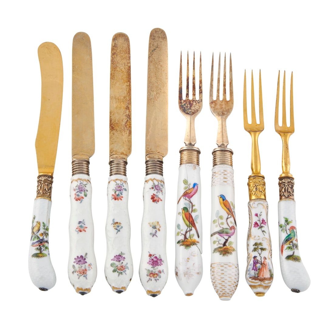 An assembled set of German porcelain handled flatware, comprising four forks, three with (1 of 2)