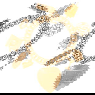 A 14k gold charm bracelet: A 14k gold charm braceletthe double curb link bracelet suspending10 charms, including a telephone, convertible car, martini glass, beer stein and Jewish prayer book; 36.13 gross dwt; length: 7 in
