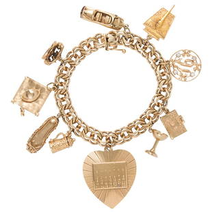 A 14k gold charm bracelet: A 14k gold charm braceletthe double curb link bracelet suspending10 charms, including a telephone, convertible car, martini glass, beer stein and Jewish prayer book; 36.13 gross dwt; length: 7 in