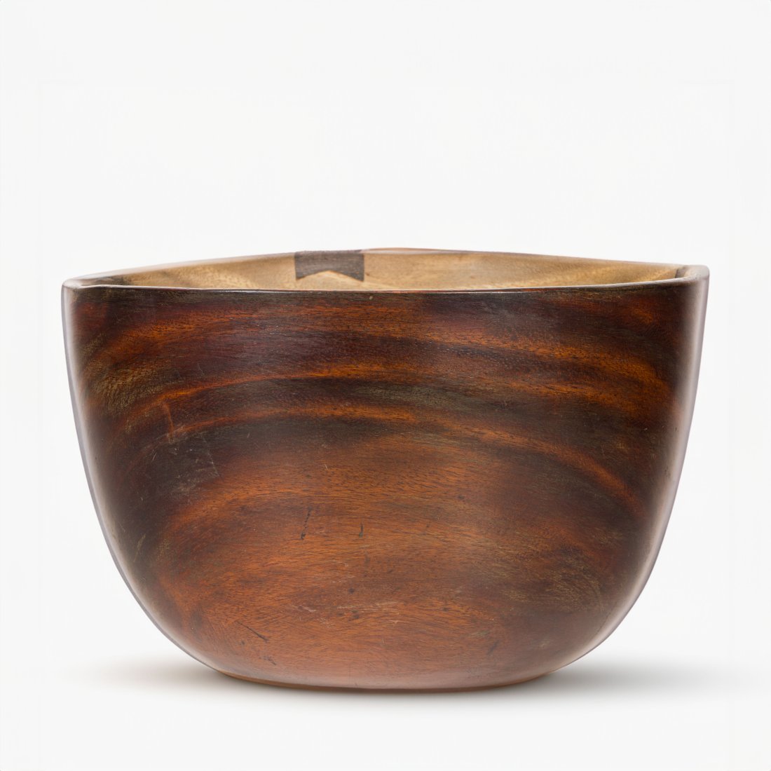 A large Hawaiian koa poi bowl: A large Hawaiian koa poi bowl, the deep well bowl thinly hewn sides, some butterfly repairs to body and to the underside, 7.25"h x 11.25"d