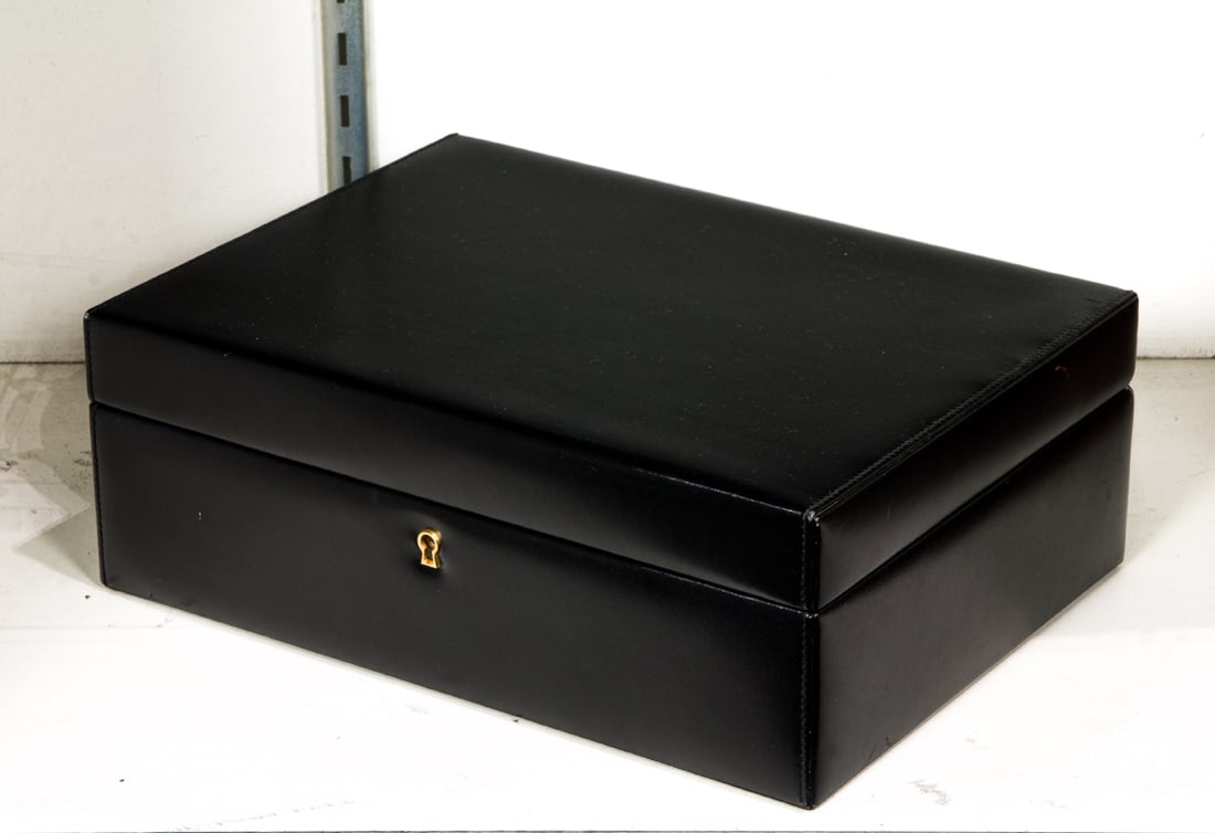 A Mark Cross black leather valet or jewelry box: A Mark Cross black leather valet or jewelry box, fitted with tray, 4.25"h x 12"w x 8.75"d