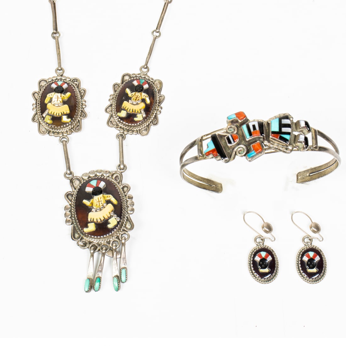 A Zuni Augustine and Rosalie Pinto Gan Dancer necklace, earrings and Natachu bracelet: A Zuni mosaic inlaid sterling jewelry lot, comprising an Augustine and Rosalie Pinto Gan Dancer necklace 17"l en suite with a matching pair earrings; a G. B. Natachu open cuff bracelet, the inside 5.2
