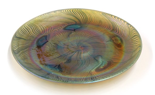 Tiffany Studios peacock plate: Tiffany Studios peacock plate, executed in favrile glass circa 1896, having a pulled iridescent surface, the underside with a ground pontil and signed L.C.T., numbered K2414, 6.25''w
