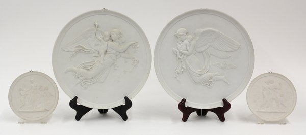 Danish bisque porcelain plaques: (lot of 4) Bing and Grondahl bisque porcelain plaques, by Eneret, the largest depicting winged maidens bearing children, and impressed 'Eneret. B&G', 19th century 11''w, the smaller depicting a Classi