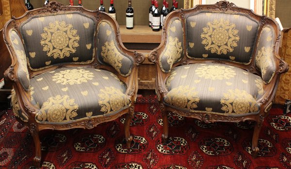 Pair Louis XV style bergeres: Pair of Louis XV style bergeres circa 1890, executed in walnut, the shaped crestrail centered with the rocaille cartouche above the padded back and rising on carved cabriole legs, 31''h x 31''w
