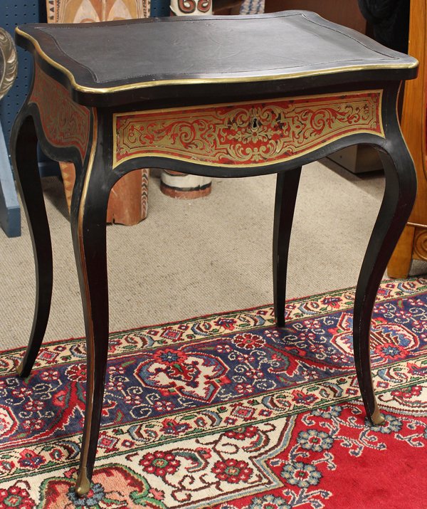 Napoleon III vanity: Napoleon III Boulle style decorated vanity circa 1870, the hinged top having a later leather panel opening to the fitted and mirrored interior, the exterior having boulle marquetry decorated reserves 